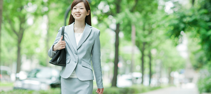 business woman walking outside